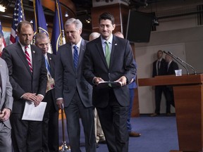 Speaker of the House Paul Ryan, R-Wis., joined at left by Majority Leader Kevin McCarthy, R-Calif., and fellow Republicans, leaves a news conference following a closed-door GOP meeting on immigration, on Capitol Hill in Washington, Wednesday, June 13, 2018. The Wisconsin Republican gave an upbeat assessment to reporters after brokering a deal between party factions on a process to consider rival GOP immigration plans to protect young "Dreamer" immigrants brought illegally to the U.S. as children.