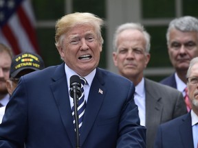 President Donald Trump speaks before signing the "VA Mission Act of 2018" during a ceremony in the Rose Garden of the White House in Washington, Wednesday, June 6, 2018. The bill will expand private care for veterans as an alternative to the troubled Veterans Affairs health system.