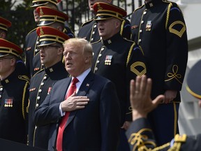 President Donald Trump sings the National Anthem with the U.S. Army Chorus during a "Celebration of America" event at the White House, Tuesday, June 5, 2018, in Washington, in lieu of a Super Bowl celebration for the NFL's Philadelphia Eagles that he canceled.