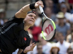 Milos Raonic returns the ball to  Lucas Pouille in their semifinal match during the ATP Mercedes Cup in Stuttgart, Saturday June 16, 2018.