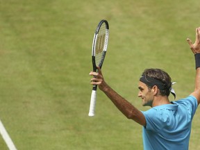 Roger Federer celebrates after he beats Matthew Ebden during their match at the Gerry Weber Open tennis tournament in Halle, Friday, June 22, 2018.