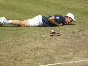 Roberto Bautista Agut lays injured on the court during the semi final match against Boran Coric at the Gerry Weber Open ATP tennis tournament in Halle, Germany, Saturday, June 23, 2018.