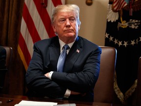 U.S. President Donald Trump listens during a cabinet meeting at the White House on June 21, 2018, in Washington.