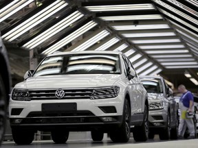 In this Thursday, March 8, 2018 photo Volkswagen cars are pictured during a final quality control at the Volkswagen plant in Wolfsburg, Germany. Germany's Volkswagen, Europe's largest automaker, is warning the Trump administration's decision to impose tariffs on aluminum and steel imports from Canada, Mexico, and the European Union could start a trade war that no side would win.