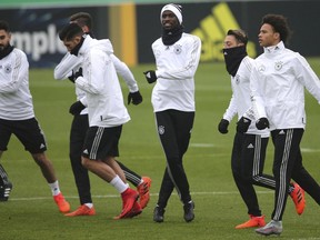 FILE -- In this Thursday, Nov. 9, 2017 photo, front from left, Ilkay Gundogan, Emre Can, Antonio Ruediger, Mesut Ozil and Leroy Sane jog during a training session of the German national soccer team in Berlin, Germany. Manchester City winger Leroy Sane has been omitted from Germany's final 23-man World Cup squad.