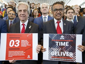 Uruguay's President Tabare Vazquez, left, and Tedros Adhanom Ghebreyesus, right, Director General of the World Health Organization (WHO) pose, during the launch of the report WHO Independent High-Level Commission on Noncommunicable Diseases (NDCs), at the headquarters of the World Health Organization (WHO) in Geneva, Switzerland, Friday, June 1, 2018.