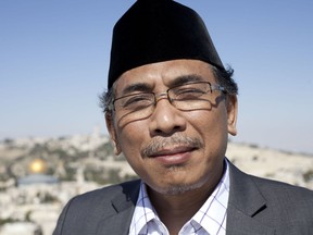 Yahya Staquf, secretary general of the 60 million member Nahdlatul Ulama poses for a photograph in overlooking Jerusalem, Monday, June 11, 2018. Indonesia, the world's largest Muslim country, does not have diplomatic relations with Israel, and support there for the Palestinians is strong. Staquf's presence has triggered angry reactions in Indonesian social media.