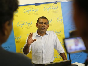 In this Thursday, May 31, 2018 photo, former Maldivian President Mohamed Nasheed interacts with supporters in Maldives through a Skype call from his residence in Colombo, Sri Lanka. Maldives first democratically elected leader, now living in exile, is reaching out to supporters in an online campaign as he hopes for the near-impossible: Another term as president. His prison sentence disqualifies him from running, and he'd be locked up if he tried to campaign back in his archipelago homeland but he's not giving up.