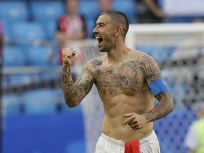 Serbia's Aleksandar Kolarov celebrates at the end of the group E match between Costa Rica and Serbia at the 2018 soccer World Cup in the Samara Arena in Samara, Russia, Sunday, June 17, 2018.