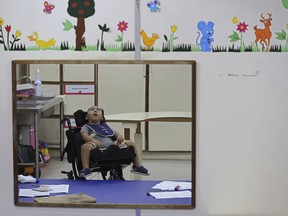 In this May 4, 2018 photo, Jose Wesley Campos, who was born with the Zika-caused microcephaly birth defect, waits for his therapy session at the Disabled Child Assistance Association, in Recife, Brazil. Despite the progress, the developmental challenges for Jose are gargantuan. He recently had hip surgery, which doctors have found necessary for many children with microcephaly as they become toddlers.