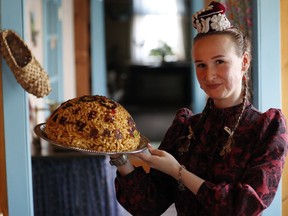 In this picture taken on Thursday, June 21, 2018, Lisan Yarullina displays a traditional chak-chak during the 2018 soccer World Cup at the Chak-Chak museum in Kazan, Russia. There is arguably more chak-chak on offer in Kazan's shops, cafes and restaurants than football fans attending soccer World Cup matches in the Tatarstan capital. The Tatar dessert that is traditionally eaten at weddings has become a symbol of the autonomous region known as the "Land of 1,001 Delights."