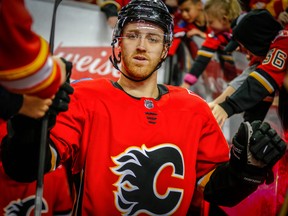 In this March 16 file photo, Calgary Flames defenceman Dougie Hamilton warms up for a game against the San Jose Sharks.