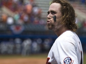 Auburn's Luke Jarvis reacts while coming off the field after hitting an RBI-single against Florida during an NCAA college super regional baseball game Sunday, June 10, 2018, in Gainesville, Fla.