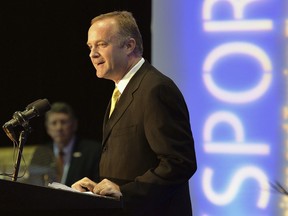 FILE - In this Oct. 22, 2014, file photo, Michael Kelly, COO of the College Football Playoff, speaks at the JAXSPORTS Speaker Series Luncheon in Jacksonville, Fla. Two people with knowledge of the decision say South Florida has hired Michael Kelly to be its new athletic director. The people spoke to The Associated Press on condition of anonymity Tuesday, June 26, 2018, because a formal announcement was being finalized.