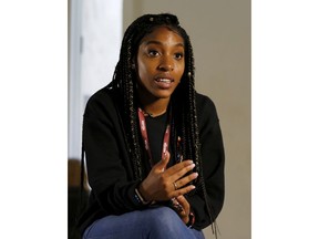 This April 12, 2018 photo shows Marjory Stoneman Douglas High School senior student Tyra Hemans speaking during an interview in Parkland, Fla. Hemans recieved her college acceptance letter from Pace University in New York on the same day her friends Joaquin "Guac" Oliver and Meadow Pollack were killed. Hemans is heading to Pace, while realizing that many of the milestones of her future life will be tinged with sadness.