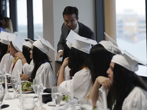 In this Tuesday, May 29, 2018 photo, Rep. Carlos Curbelo, R-Fla., greets graduates while attending the 34th Annual Farmworker Student Recognition Ceremony in Homestead, Fla. In a district stretching from upscale Miami suburbs to the Everglades and down the Florida Keys to eccentric Key West, 70 percent of Curbelo's constituents are Hispanic and nearly half are foreign born. Those are among the highest percentages in the nation, giving many a first-hand stake in Congress' immigration fight.
