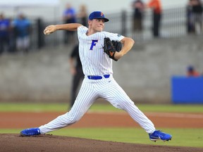 Florida pitcher Jack Leftwich throws against Auburn during the first inning of an NCAA Super Regional college baseball game Monday, June 11, 2018, in Gainesville, Fla.