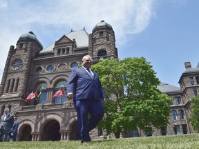 Ontario premier-elect Doug Ford walks out onto the front lawn of the Ontario Legislature at Queen's Park in Toronto on Friday, June 8, 2018.