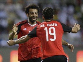 FILE - In this Feb. 1, 2017 fiel photo Egypt's Mohamed Salah, left, celebrates after scoring the opening goal during the African Cup of Nations semifinal soccer match between Burkina Faso and Egypt at the Stade de l'Amitie, in Libreville, Gabon. The Egypt squad in Russia for its first World Cup since 1990 has a nickname besides the Pharaohs.