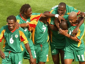 FILE - In this June 11, 2002 file photo Senegal's players celebrate after scoring their third goal in the first half of their 2002 World Cup Group A soccer match against Uruguay at the Suwon World Cup stadium in Suwon, South Korea. From left are Aliou Cisse, Alassane Ndour, Henri Camara, Khalilou Fadiga, Papa Bouba Diop (hidden) and El Hadji Diouf. The other teams in Group A are France and Denmark.