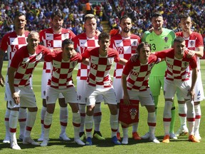 FILE - In this June 3, 2018 photo Croatia team poses for photographers prior to the friendly soccer match between Brazil and Croatia at Anfield Stadium in Liverpool, England.