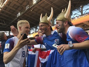 Iceland's Hordur Magnusson talks to fans after the group D match between Argentina and Iceland at the 2018 soccer World Cup in the Spartak Stadium in Moscow, Russia, Wednesday, June 13, 2018.