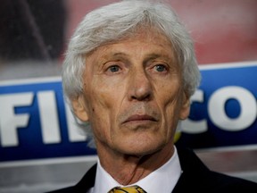 FILE - In this Tuesday, Oct.10, 2017 filer, Colombia coach Jose Pekerman sits on the bench during a 2018 World Cup qualifying soccer match between Peru and Colombia in Lima, Peru.