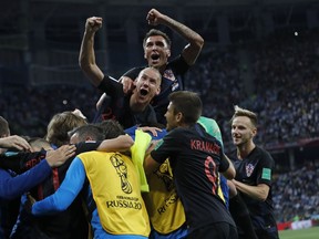 Croatia players celebrate after teammate Luka Modric scored their side's second goal during the group D match between Argentina and Croatia at the 2018 soccer World Cup in Nizhny Novgorod Stadium in Nizhny Novgorod, Russia, Thursday, June 21, 2018.