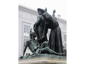 FILE - This March 2, 2018 file photo shows a statue that depicts a Native American at the feet of a Spanish cowboy and Catholic missionary in San Francisco. Activists urging the removal of the prominent 19th century statue will get another chance to make their case. The San Francisco Chronicle reports the city's Board of Appeals voted Wednesday, June 13 to grant a rehearing on removing the "Early Days" statue near City Hall.