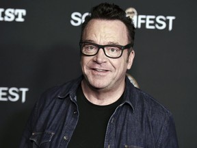 FILE - In this Oct. 10, 2017 file photo, Tom Arnold attends the premiere of "Dead Ant" in Los Angeles.  Michael Cohen, President Donald Trump's former attorney, retweeted a photo posing with Arnold, who is working on a show to hunt down recordings of the president. The photo fueled speculation Friday, June 22, 2018, that Cohen has secret tapes of Trump and is willing to share them.