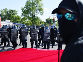 Protesters march in Quebec City on June 8, 2018, as the G7 Summit gets underway.