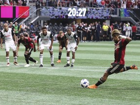 Atlanta United's Josef Martinez scores a goal on a penalty kick against the Philadelphia Union during the first half of an MLS soccer match Saturday, June 2, 2018, in Atlanta.