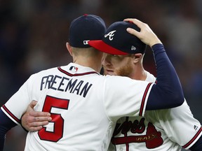 Atlanta Braves starting pitcher Mike Foltynewicz, right, hugs first baseman Freddie Freeman (5) after the team's 4-0 win in a baseball game against the Washington Nationals on Friday, June 1, 2018, in Atlanta. Foltynewicz pitched a two-hitter.