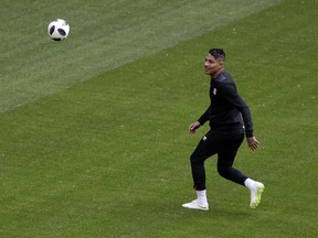 Peru's Paolo Guerrero warms up on the pitch during Peru's official training on the eve of the group C match between Peru and Denmark at the 2018 soccer World Cup in the Mordovia Arena in Saransk, Russia, Friday, June 15, 2018.