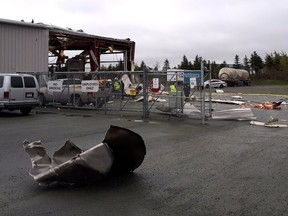 Scattered debris is shown at the scene of an explosion in Mount Pearl, N.L., on Tuesday, June 19, 2018. Three people have been taken to hospital after an explosion at a business in an industrial area of Mount Pearl, N.L.