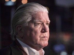 In this June 27, 2017 file photo, Brian Burke speaks to reporters in Toronto.