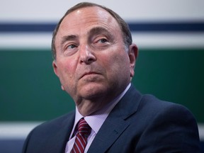 In this Feb. 28 file photo, NHL commissioner Gary Bettman listens to questions at a news conference in Vancouver.