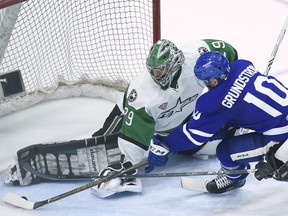 Texas Stars goaltender Mike McKenna stops Toronto Marlies forward Carl Grundstrom in Game 6 of the AHL's Calder Cup final in Toronto on June 12.