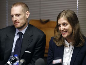 Rita Bettis, right, American Civil Liberties Union of Iowa Legal Director, speaks during a news conference as Emma Goldman Clinic attorney Sam Jones, left, looks on, Friday, June 1, 2018, in Des Moines, Iowa. A judge says he'll temporarily block the most restrictive abortion law in the country from taking effect in Iowa next month. The decision comes under an agreement between lawyers for the state and abortion rights groups that filed a lawsuit challenging the law.