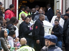 In this May 5, 2014 photo, the casket of Endia Martin is carried by pallbearers following funeral services for 14-year-old at St. Andrew Temple Baptist Church in Chicago. Martin was killed by another 14-year-old in what started as a Facebook feud over a boy. Sentencing is scheduled on Wednesday, June 20, 2018, in juvenile court for the teen who pleaded guilty in the death of Martin in January. Under the law she faces a mandatory sentence of five years in custody, or until the age of 21. The teen, who is now 18, can be paroled when she turns 19 next month.