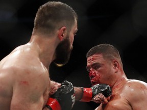 Andrei Arlovski, left, lands a punch on Tai Tuivasa during a heavyweight UFC 225 Mixed Martial Arts bout Saturday, June 9, 2018, in Chicago.