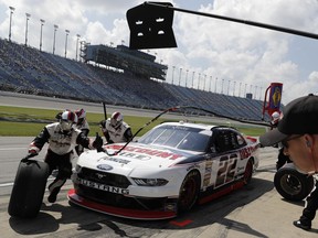 Paul Menard makes a pit stop during a NASCAR Xfinity Series auto race at Chicagoland Speedway in Joliet, Ill., Saturday, June 30, 2018.