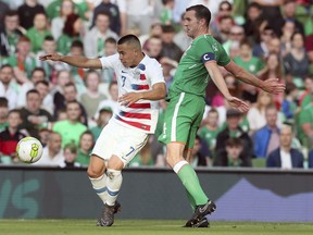 United States' Bobby Wood, left, and Republic of Ireland's John O'Shea battle for the ball during the International Friendly match at the Aviva Stadium, Dublin, Ireland, Saturday June 2, 2018.