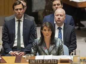 FILE -  In this Feb. 20, 2018 file photo, Jared Kushner, left, and Jason Greenblatt, right, listen as American Ambassador to the United Nations Nikki Haley speaks during a Security Council meeting on the situation in Palestine at United Nations headquarters. On their current Mideast tour, senior Trump administration officials Kushner and envoy Jason Greenblatt are getting a close-up view of towering obstacles to their yet-to-be-released blueprint for an Israeli-Palestinian peace deal.
