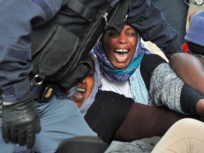 Italian Police remove migrants in Ventimiglia, at the Italian-French border Tuesday, June 16, 2015.