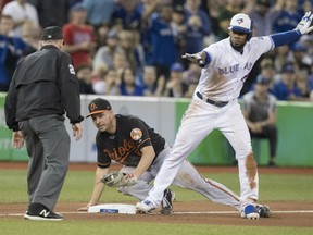 Teoscar Hernandez of the Toronto Blue Jays makes his own safe call on a play at third base during MLB action Friday at Rogers Centre. Umpire Lance Barksdale agreed with Hernandez, decreeing the tag from Baltimore Orioles' Danny Valancia wasn't applied in time. The Jays were 5-1 winners.