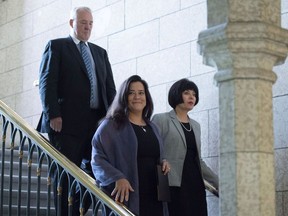 Minister of Justice and Attorney General of Canada Jody Wilson-Raybould, centre, Minister of Health Ginette Petitpas Taylor, right, and Parliamentary Secretary to the Minister of Justice and Attorney General of Canada and to the Minister of Health Bill Blair, behind, arrive for a press conference on Bill C-45, the Cannabis Act, in the Foyer of the House of Commons on Parliament Hill in Ottawa on Wednesday, June 20, 2018.