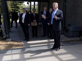 U.S. President Donald Trump speaks to reporters as he departs from the G7 leaders summit in La Malbaie, Que., on Saturday, June 9, 2018.