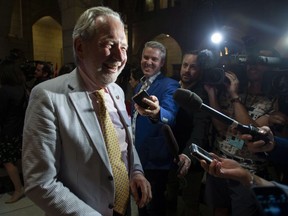 Sen. Peter Harder, Government Representative in the Senate, laughs in response to a reporter's question about his outfit, after the vote on Bill C-45, the Cannabis Act in the Senate on Parliament Hill in Ottawa on Tuesday, June 19, 2018.