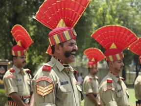 Indian Border Security Force (BSF) soldiers pay tribute to four of their colleagues who were killed early Wednesday during a wreath-laying ceremony at the BSF headquarters in Jammu, India, Wednesday, June 13, 2018. Indian and Pakistani forces fired along the highly militarized frontier in disputed Kashmir early Wednesday after Pakistani firing killed at least four Indian paramilitary soldiers and injured three others on border patrol, Indian officials said.